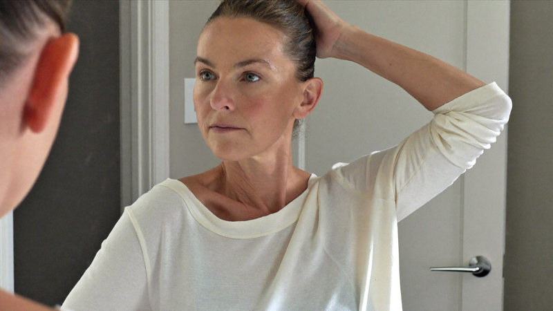 Woman noticing hair thinning